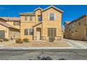Charming two-story home with desert landscaping and neutral color palette at 5024 Stone Bay Ave, Las Vegas, NV 89131