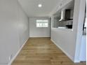 Bright dining area with laminate wood flooring and a view of the kitchen at 604 N Minnesota St, Las Vegas, NV 89107