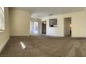 A bright and spacious living room with neutral tones and ample natural light at 6800 E Lake Mead Blvd # 2011, Las Vegas, NV 89156