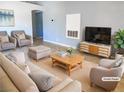 Bright living room showcasing neutral tones, modern decor, and an open floor plan, virtually staged at 8032 Astrology Ct # 201, Las Vegas, NV 89128