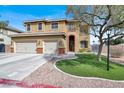 Charming two-story home featuring a manicured lawn, three-car garage, and inviting front entrance at 8102 Villa De La Playa St, Las Vegas, NV 89131