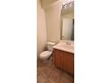 Bathroom featuring tile flooring, a wood vanity and a toilet at 8120 Finch Feather St, Las Vegas, NV 89143