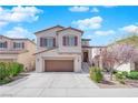 Charming two-story home featuring a well-maintained front yard, a two-car garage and covered front entry at 10973 Sardinia Sands Dr, Las Vegas, NV 89141