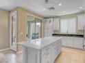 Spacious kitchen includes a center island with drawers, and access to the backyard patio at 11820 Calle De Sol Dr, Las Vegas, NV 89138
