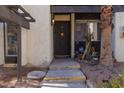 Inviting front entrance with a decorative door, flower box, and covered porch area at 1390 Vegas Valley Dr # 25, Las Vegas, NV 89169