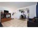Bright living room featuring tile floors, with an open floor plan to the dining area at 1390 Vegas Valley Dr # 25, Las Vegas, NV 89169