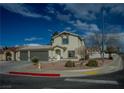 Charming home featuring a two-car garage with a spacious driveway and simple desert landscaping at 172 Cloudcrest Dr, Henderson, NV 89015