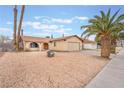 Charming single-story home with desert landscaping, a two-car garage, and a well-maintained yard at 212 N Torrey Pines Dr, Las Vegas, NV 89107