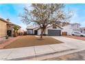 Charming single-story home featuring a two-car garage and low-maintenance front yard at 2120 Maple Springs St, Henderson, NV 89002