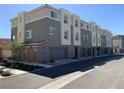Contemporary townhomes showcasing modern design, private garages, and landscaped surroundings at 2775 Atomic Tangerine Way # 4, Las Vegas, NV 89183
