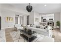 Bright and airy living room features neutral tones, stylish furnishings, and open layout at 3916 S Torrey Pines Dr, Las Vegas, NV 89103