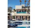 Beautiful pool area with submerged seating, cabanas and palm trees at 4381 W Flamingo Rd # 1510, Las Vegas, NV 89103