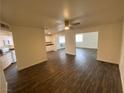 Open-concept living space showcasing dark wood floors, recessed lighting and neutral walls at 4843 Lana Dr, Las Vegas, NV 89121