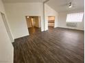 Bright, open-concept living room featuring dark wood flooring and neutral paint at 4843 Lana Dr, Las Vegas, NV 89121
