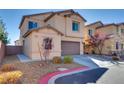 Charming two-story home features a well-maintained front yard and a two-car garage at 4908 Desert Lime Ct, Las Vegas, NV 89148