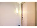 Hallway features unit number 205, light fixture, a door and dark granite flooring at 51 E Agate Ave # 205, Las Vegas, NV 89123