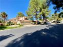 Beautiful house with a tile roof, lush greenery, and a three-car garage in a desirable neighborhood at 5381 Waving Sage Dr, Las Vegas, NV 89149