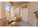 Inviting covered patio with comfortable seating and a view to the neighborhood at 59 Desert Dawn Ln, Henderson, NV 89074