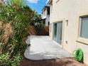 Outdoor patio with a desert landscaped yard, block wall, and easy access from the sliding door at 6245 Blushing Willow St, North Las Vegas, NV 89081