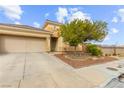 Inviting single-story home with well-maintained front yard, desert landscaping, and a two car garage at 6711 Quarterhorse Ln, Las Vegas, NV 89148