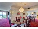 Bright dining space featuring a dazzling chandelier and easy access to the balcony at 750 S Royal Crest Cir # 345, Las Vegas, NV 89169