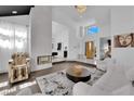 Stunning living room with open floorplan, fireplace, and ample seating at 8170 Round Hills Cir, Las Vegas, NV 89113