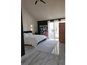 Bright main bedroom featuring a modern aesthetic and sliding glass doors at 8170 Round Hills Cir, Las Vegas, NV 89113