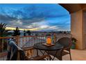 Relaxing balcony featuring a table, chairs, and expansive views of the surrounding landscape at 9475 Windham Heights Ct, Las Vegas, NV 89139