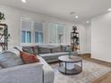 Inviting living room with neutral tones, plush seating, and stylish decor for relaxation and entertaining at 4735 Agave Cactus St, North Las Vegas, NV 89031