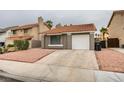 Charming single-story home with a desert landscape and a red tile roof at 1744 La Cruz Dr, Henderson, NV 89014