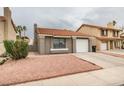 Charming single-story home with a desert landscape and a red tile roof at 1744 La Cruz Dr, Henderson, NV 89014