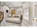 Serene main bedroom featuring a fireplace, neutral tones, and an ensuite bathroom with soaking tub at 2608 Sun Reef Rd, Las Vegas, NV 89128