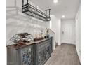 Entryway featuring hard surface flooring, beverage center, and white walls at 2682 Weathered Copper Ave, North Las Vegas, NV 89086