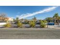 The property has great curb appeal with new landscaping, a secure fence, and a modern design at 2870 Belcastro St, Las Vegas, NV 89117