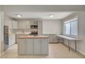 Bright kitchen offering stainless steel appliances, island, and breakfast bar space for modern living at 304 Orland St # 38, Las Vegas, NV 89107