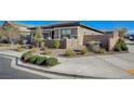 Charming one-story home with desert landscaping and a cozy front patio area, perfect for relaxing at 370 Mano Destra Ln, Henderson, NV 89011
