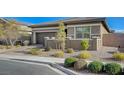 Charming one-story home with desert landscaping and a cozy front patio area, perfect for relaxing at 370 Mano Destra Ln, Henderson, NV 89011