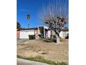 Single-story home featuring a desert landscape, with a large tree in the front yard at 3748 E Hacienda Ave, Las Vegas, NV 89120