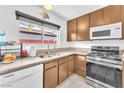 Well-lit kitchen with modern appliances, granite countertops, and ample cabinet space at 4153 Broadriver Dr, Las Vegas, NV 89108