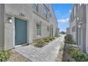 Charming gray home with a light blue front door, complemented by a stone pathway and manicured landscaping at 4932 Chidlaw Ave # 2, Las Vegas, NV 89115