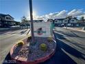 View of The Keys entrance sign, framed by desert landscaping, providing a welcoming feel to the community at 5151 Lindell Rd # 103, Las Vegas, NV 89118