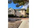 A well-maintained two-story condo building with desert-friendly landscaping and convenient parking at 5151 Lindell Rd # 103, Las Vegas, NV 89118