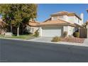 Charming two-story home with a well-maintained lawn and a two-car garage at 5452 Big Sky Ln, Las Vegas, NV 89149