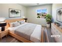 Cozy bedroom with a comfortable bed, stylish decor, and a sunny window view at 6236 Sereno Springs St, North Las Vegas, NV 89081