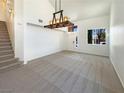 Spacious living room with neutral carpeting and abundant natural light at 6236 Sereno Springs St, North Las Vegas, NV 89081