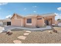 Charming single-story home with low-maintenance desert landscaping, stepping stones and two car garage at 7621 Gosport Ave, Las Vegas, NV 89131