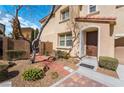 Charming home exterior showcasing a landscaped front yard, brick walkway, and welcoming entrance at 9071 Mount Wilson St, Las Vegas, NV 89113