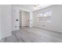 Bright living room features modern gray flooring and a ceiling fan at 9071 Mount Wilson St, Las Vegas, NV 89113