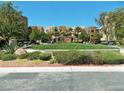 Well-maintained community park with manicured greenery, benches, and walking paths at 9359 Brigham Ave, Las Vegas, NV 89178