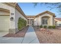 Welcoming single-story home with desert landscaping and inviting front entrance at 9920 Netherton Dr, Las Vegas, NV 89134